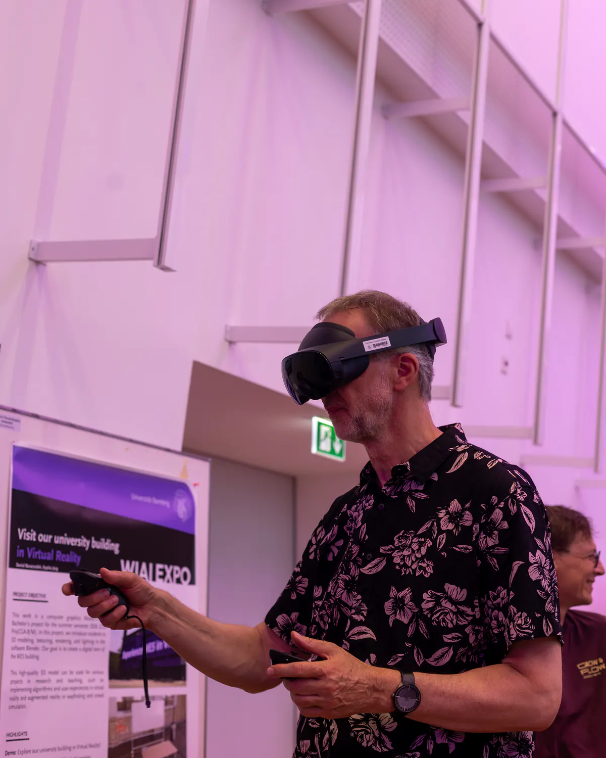 A visitor in a virtual reality headset holds a controller